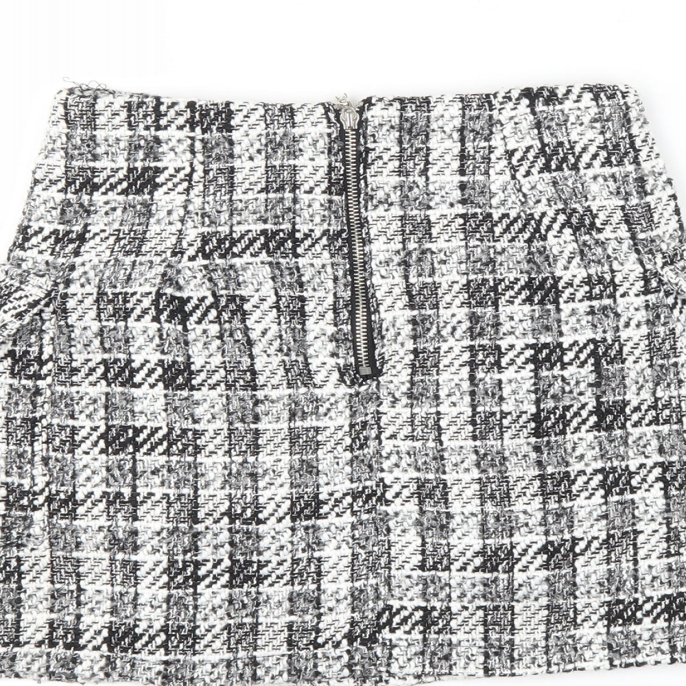 Brand and care label for Preworn women’s black check a-line skirt, size UK 26, in