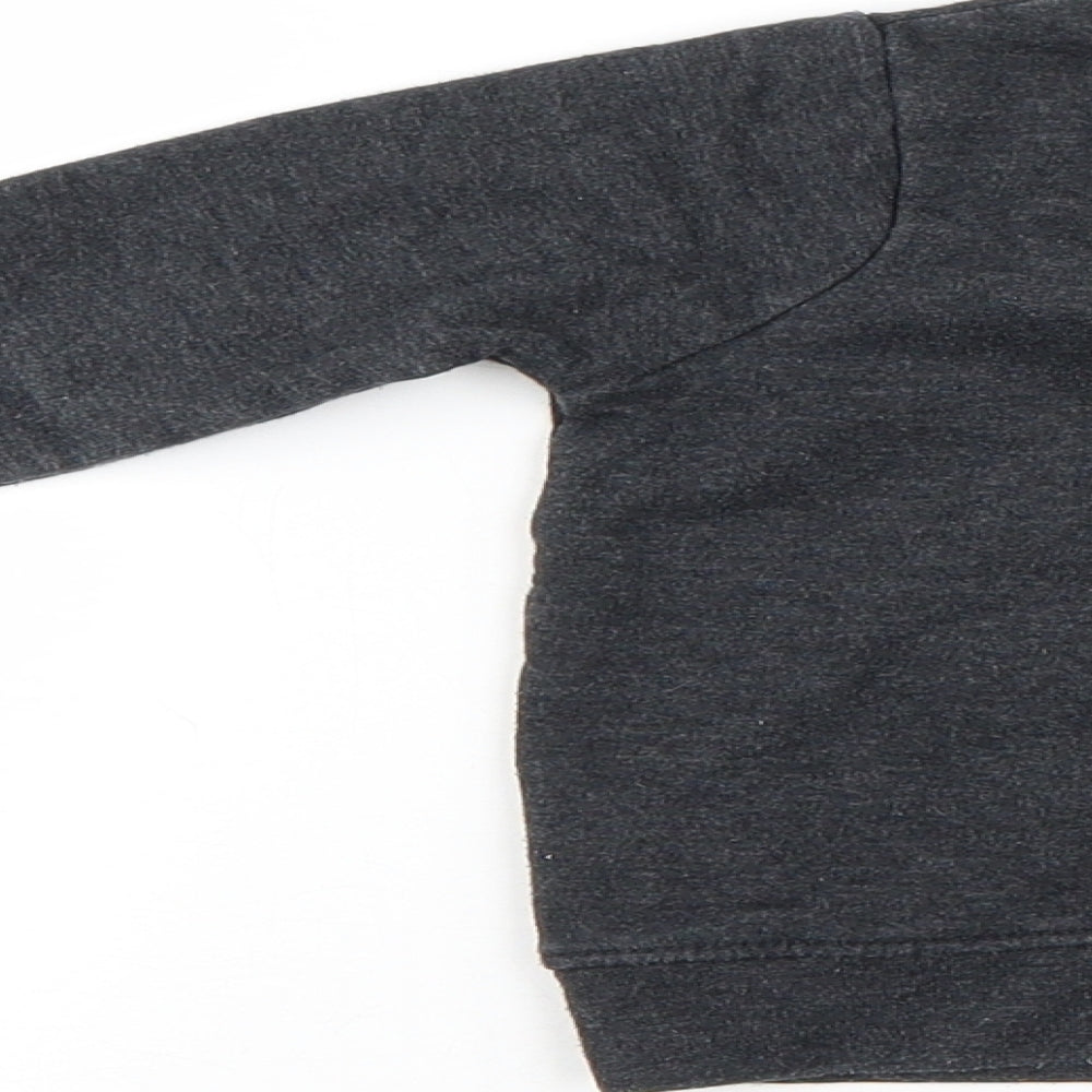 Brand and care label for Mini Rebel boys’ black jumper, size 12-18, months