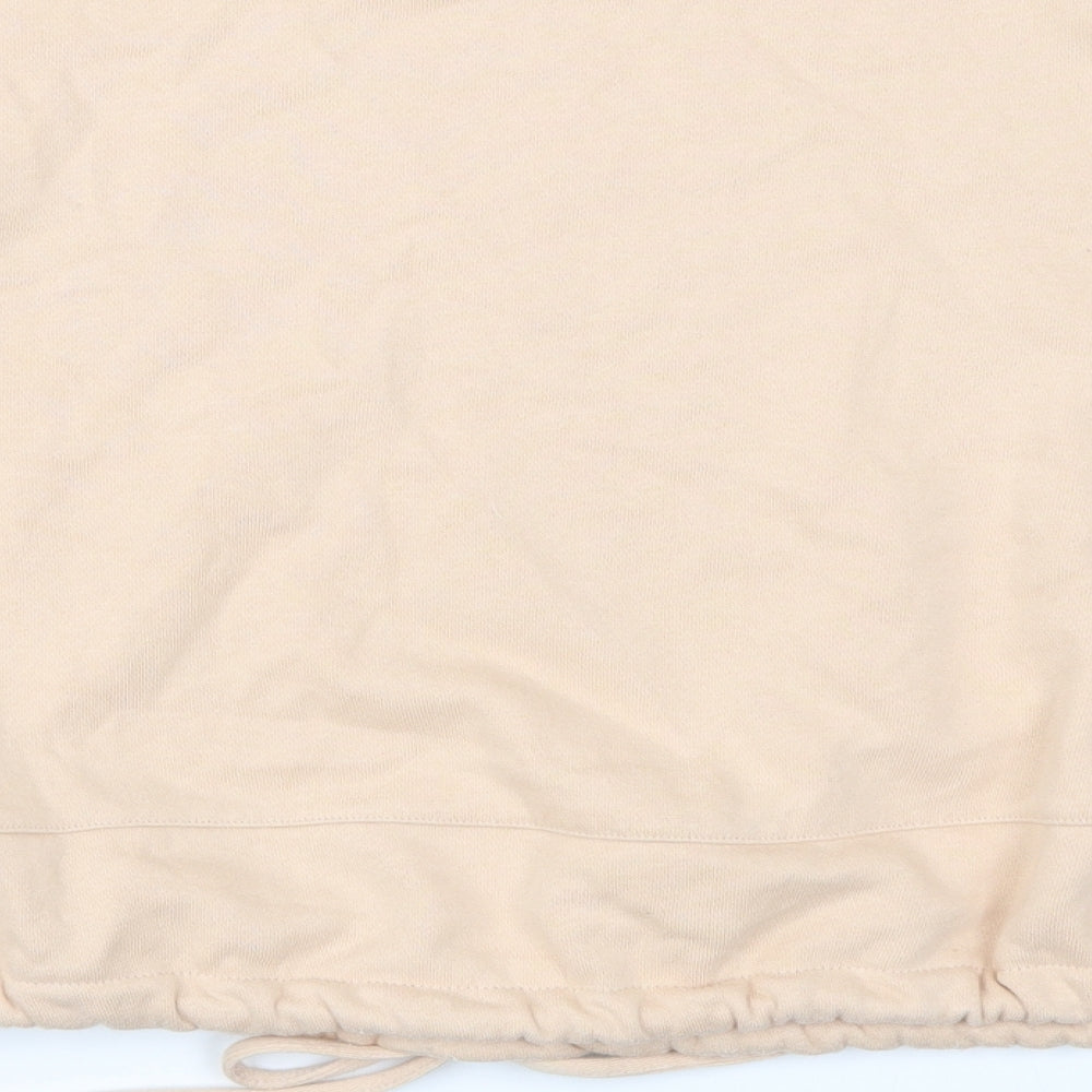 Brand and care label for Marks & Spencer women’s beige striped pullover sweatshirt, size UK 12
