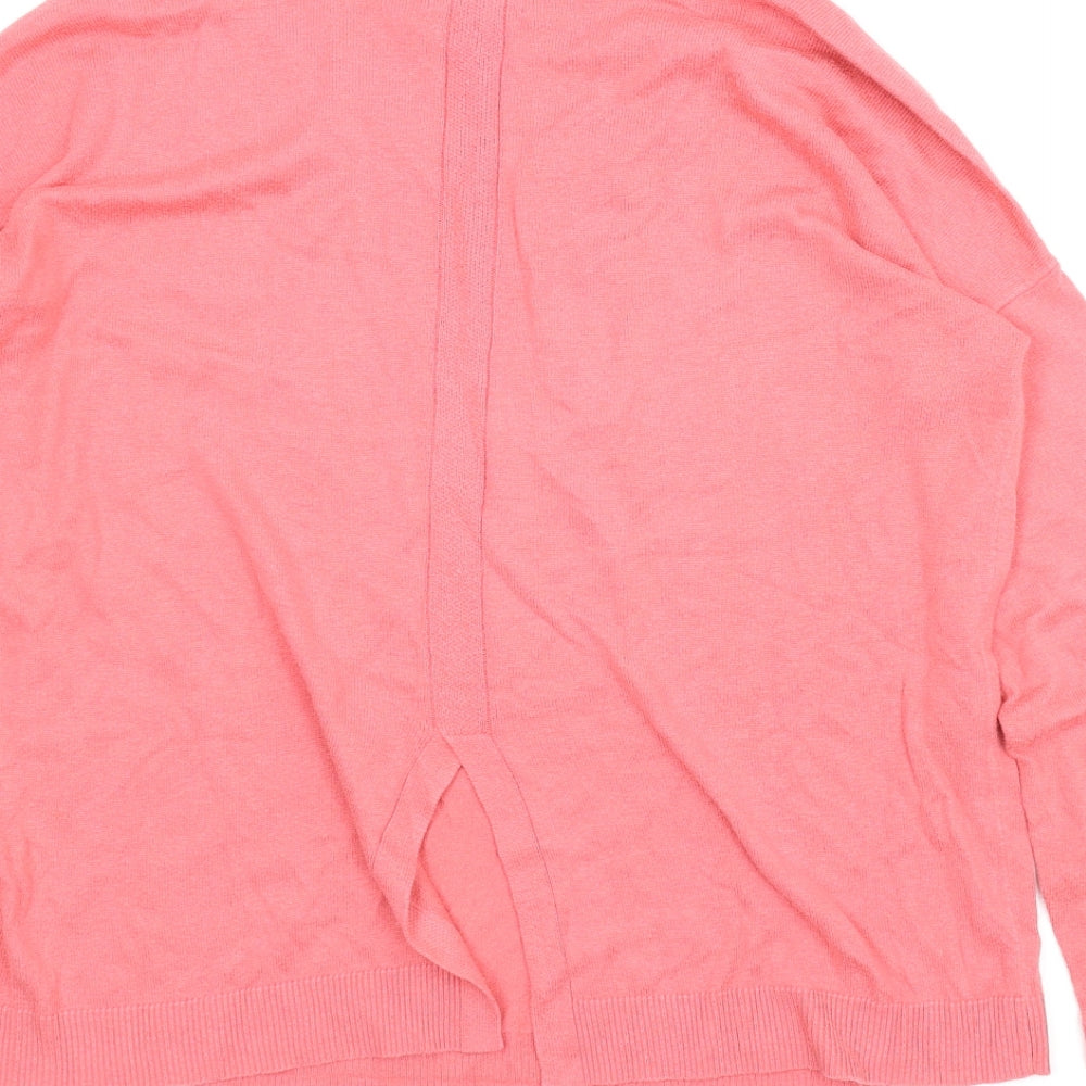Brand and care label for Gap women’s pink jumper, size M