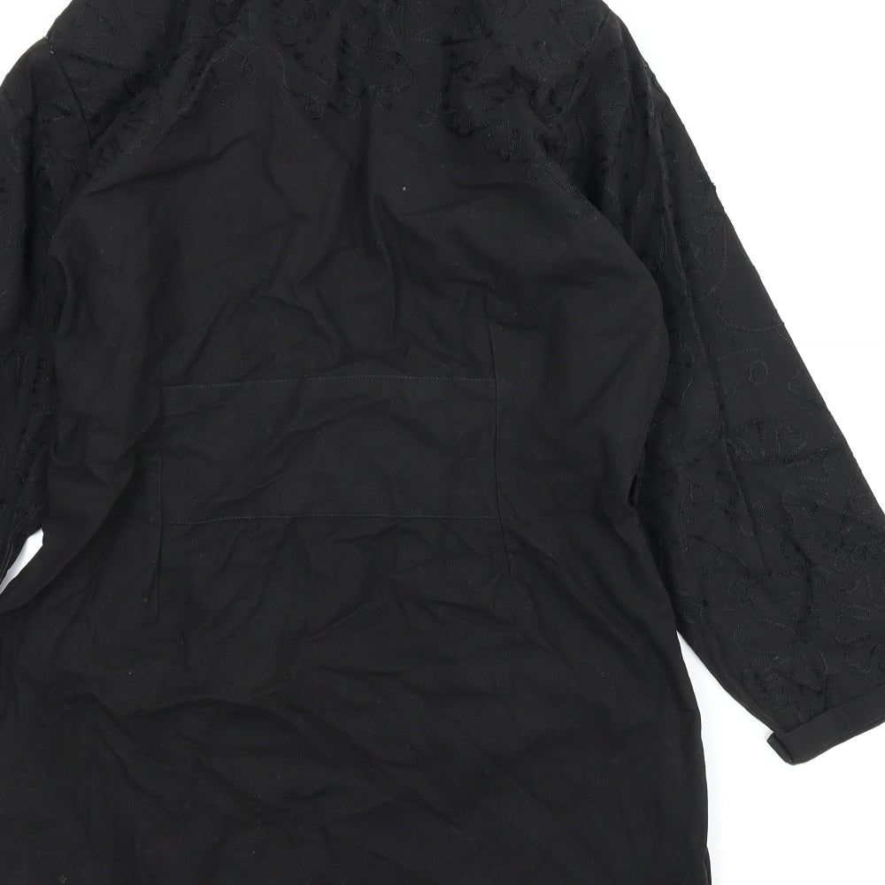 Brand and care label for Wallis Exclusoive women’s black floral cardigan jumper, size UK 12