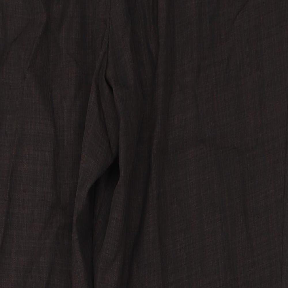 Brand and care label for Marks & Spencer women’s brown trousers, size UK 16, 26-inch leg