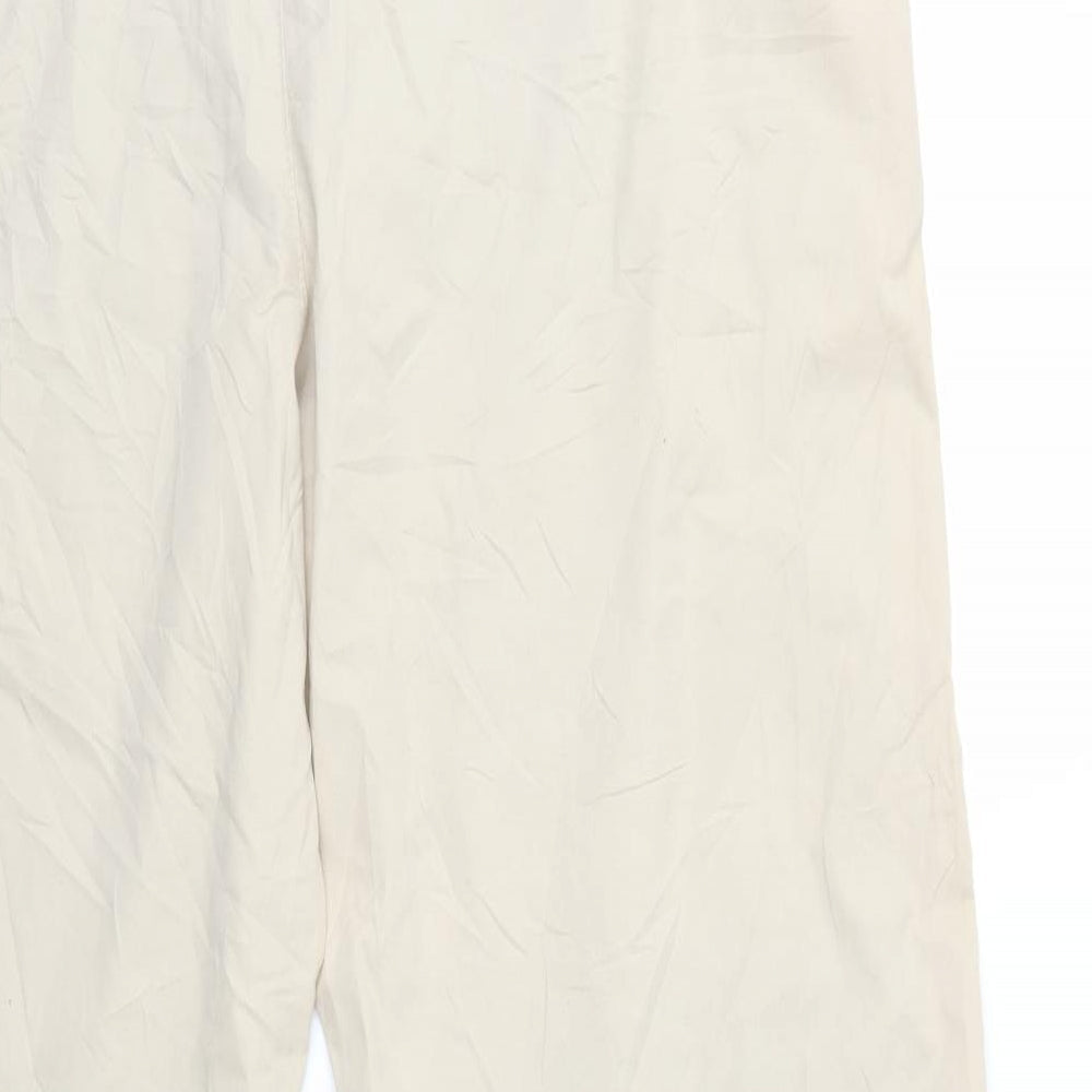 Brand and care label for Marks & Spencer women’s beige trousers, size UK 20, 29-inch leg