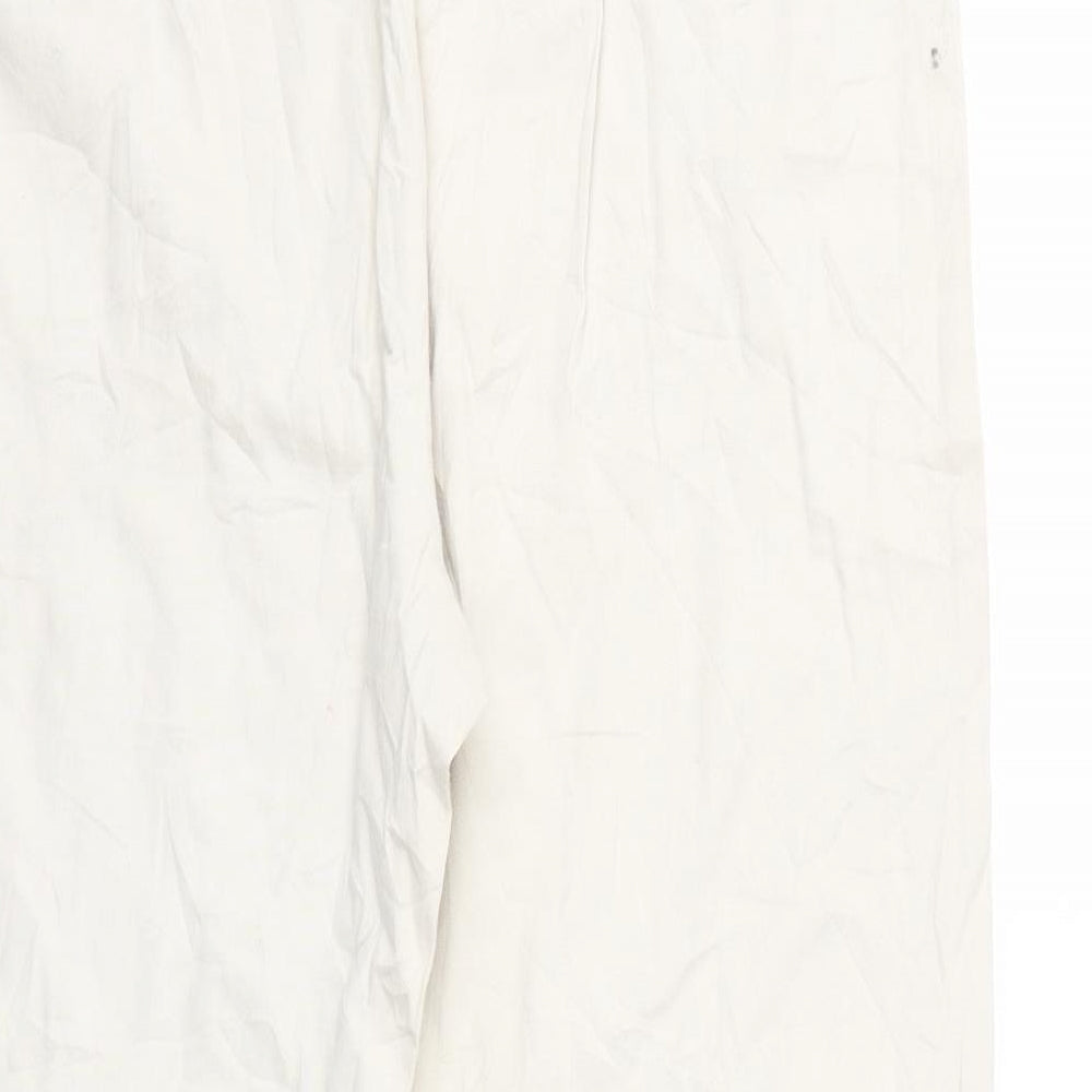 Brand and care label for phillip chi women’s beige cropped trousers, size UK 10, 25-inch leg