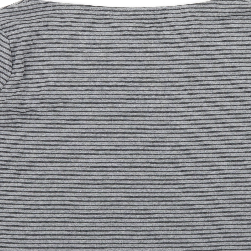 Brand and care label for CG women’s green striped jumper, size L