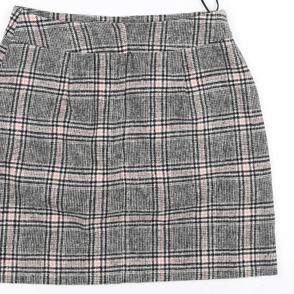 Brand and care label for Peacocks women’s white striped a-line skirt, size UK 8