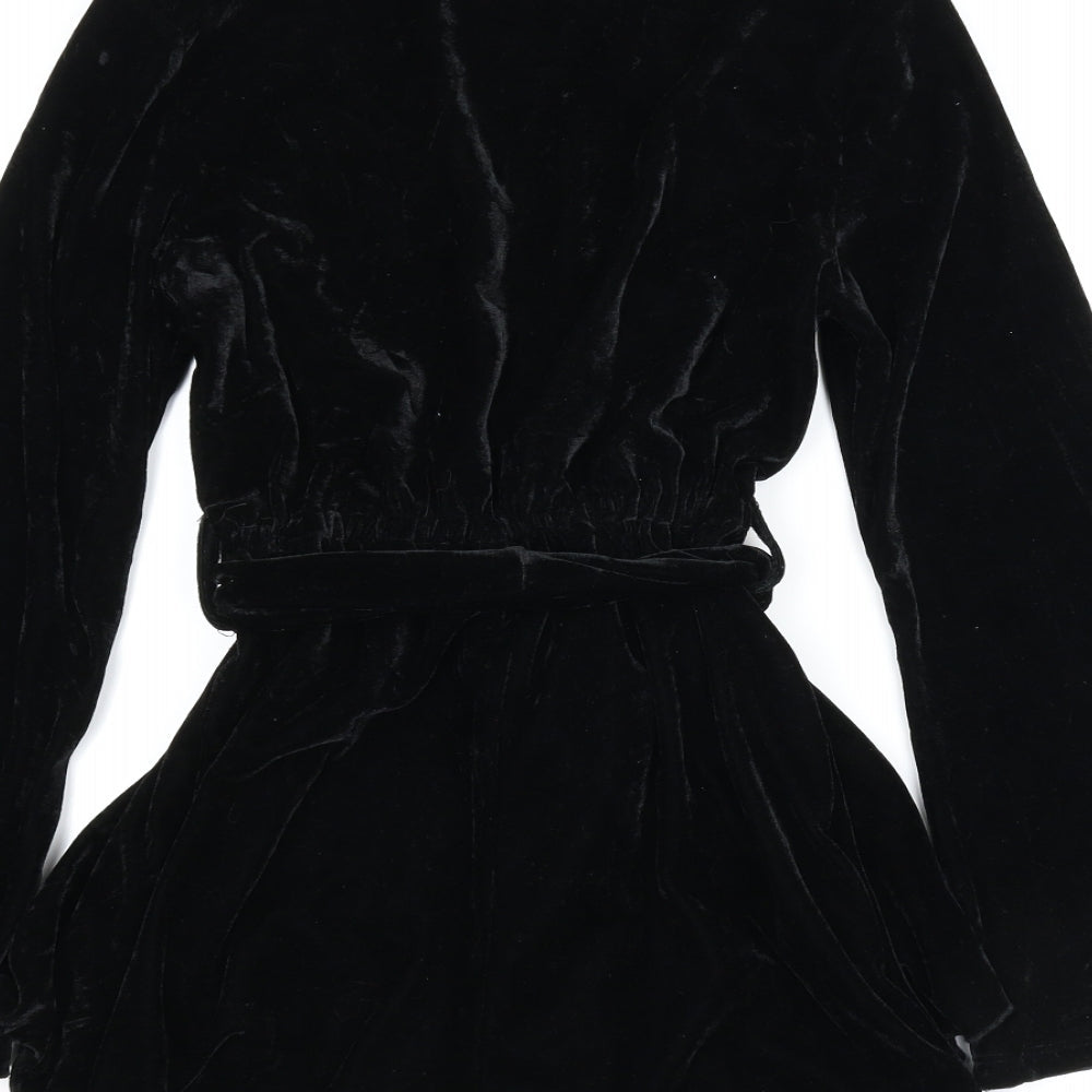 Brand and care label for Boohoo women’s black romper one-piece, size UK 6