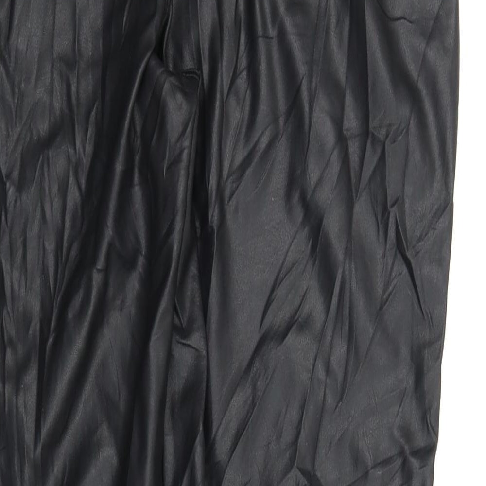 Brand and care label for Topshop women’s black trousers, size UK 14, 26-inch leg
