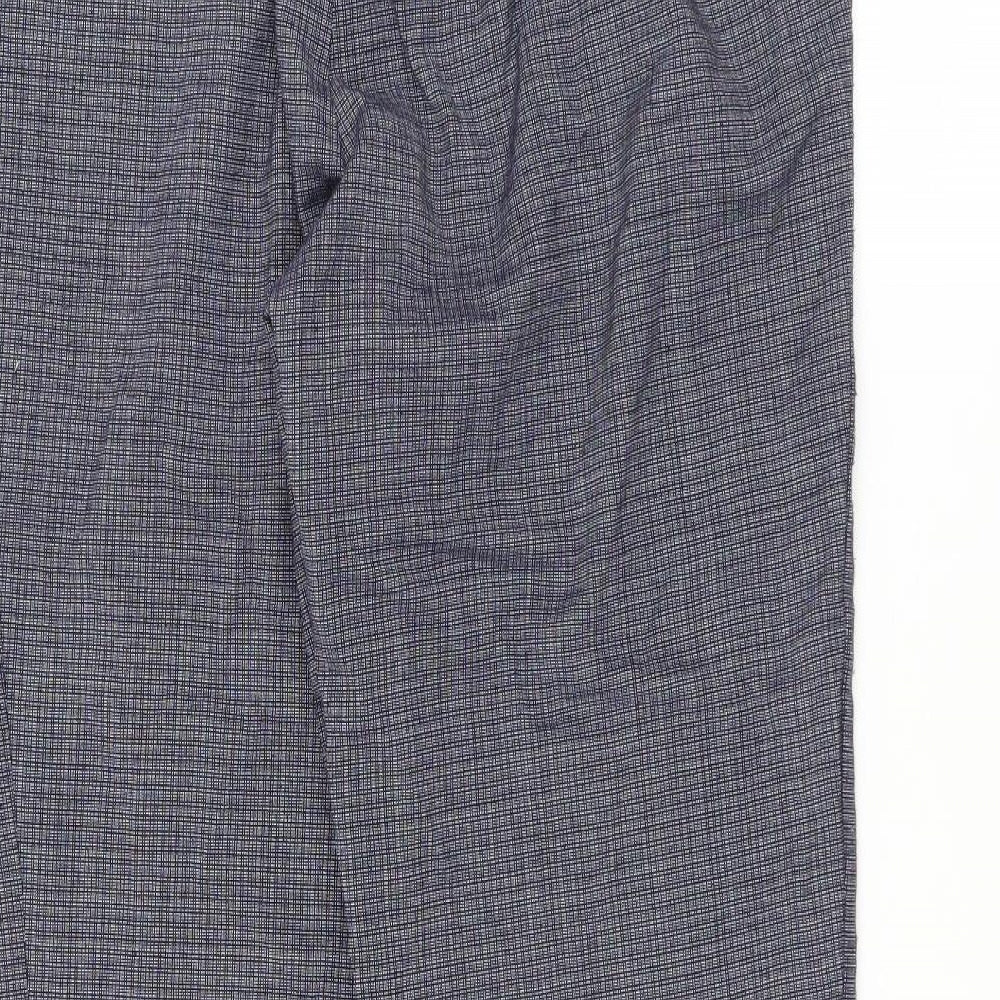 Brand and care label for Marks & Spencer women’s blue trousers, size UK 12, 28-inch leg