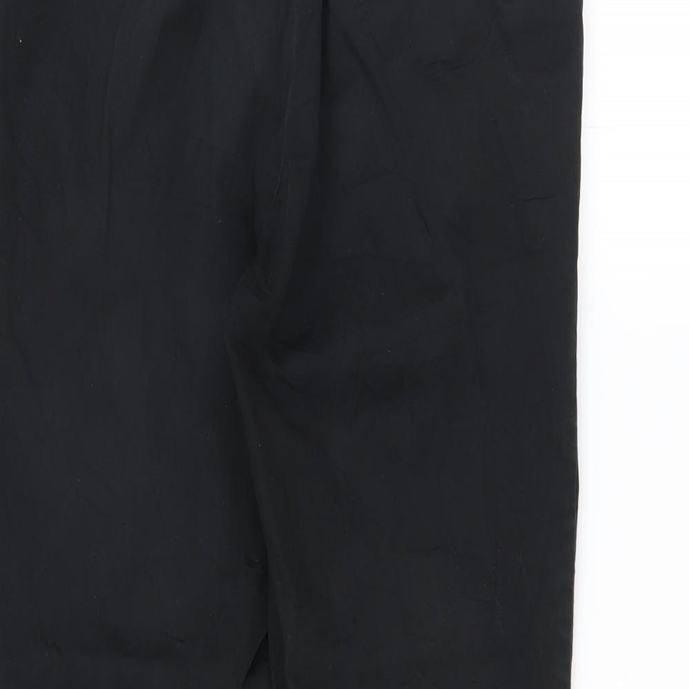 Brand and care label for H&M men’s black trousers, size 30, in, 24-inch leg