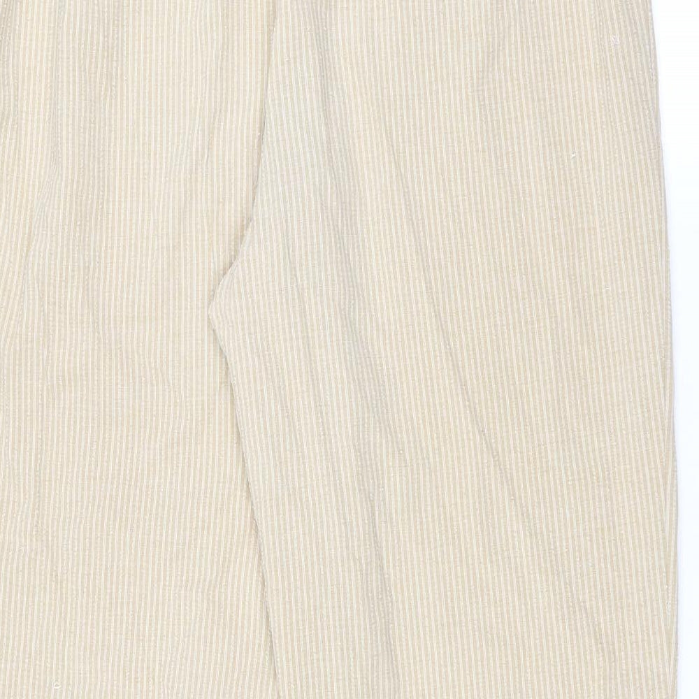 Brand and care label for Marks & Spencer women’s beige striped trousers, size UK 18, 27-inch leg