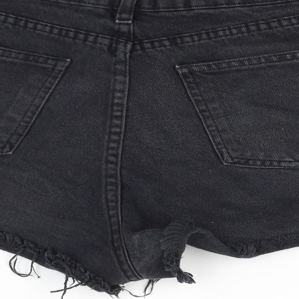 Brand and care label for Pieta women’s black cut-off shorts, size UK 10