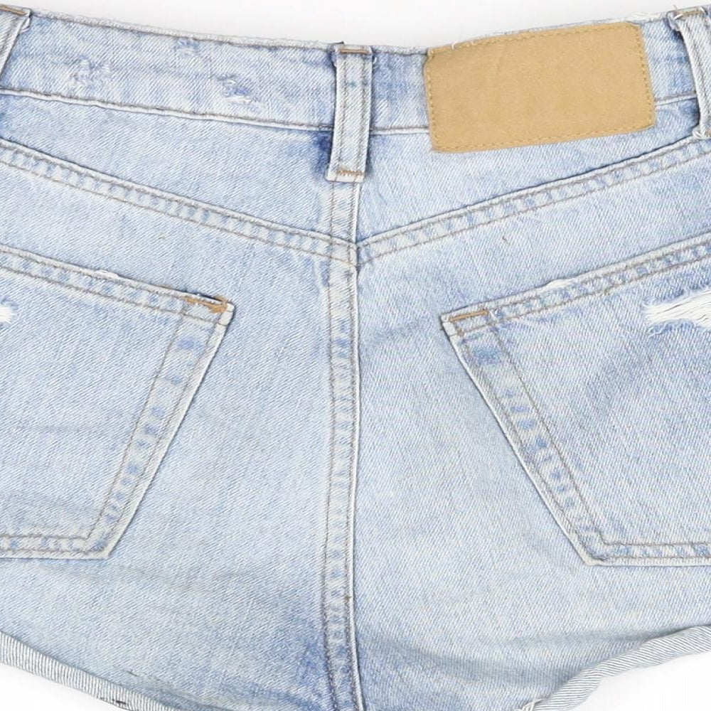 Brand and care label for Divided women’s blue cut-off shorts, size UK 4