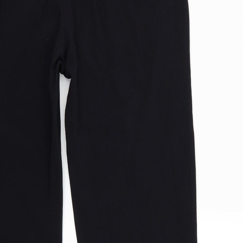 Brand and care label for Lycra women’s black trousers, size XL, 29-inch leg