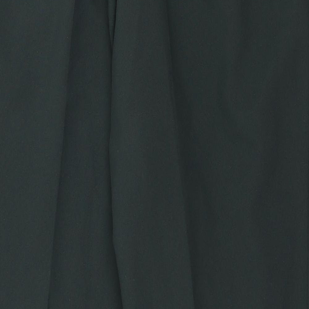 Brand and care label for Marks & Spencer women’s green trousers, size UK 18, 27-inch leg