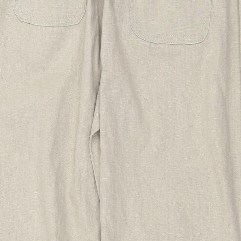 Brand and care label for 1932 women’s beige trousers, size UK 36, in, 29-inch leg