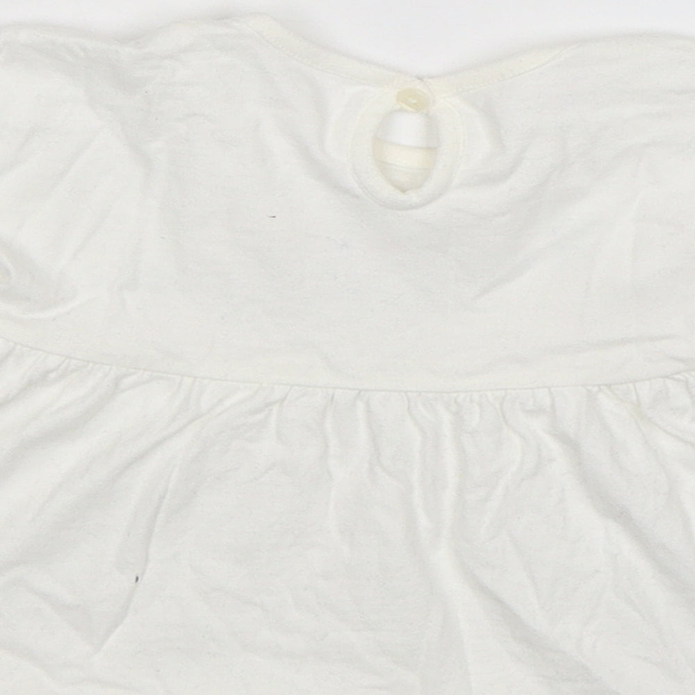 Brand and care label for George girls’ white t-shirt dress, size 6-9, months