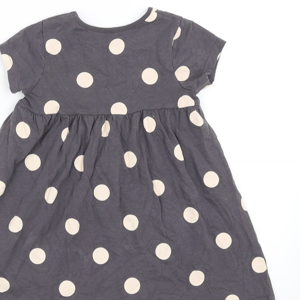 Brand and care label for George girls’ purple polka dot t-shirt dress, size 18-24, months