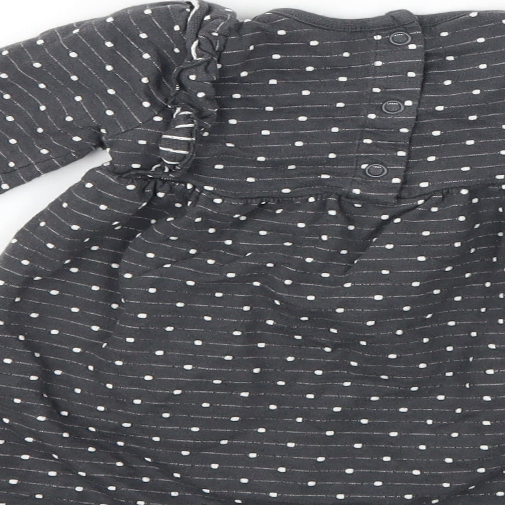 Brand and care label for George girls’ grey polka dot t-shirt dress, size 6-9, months - zebra