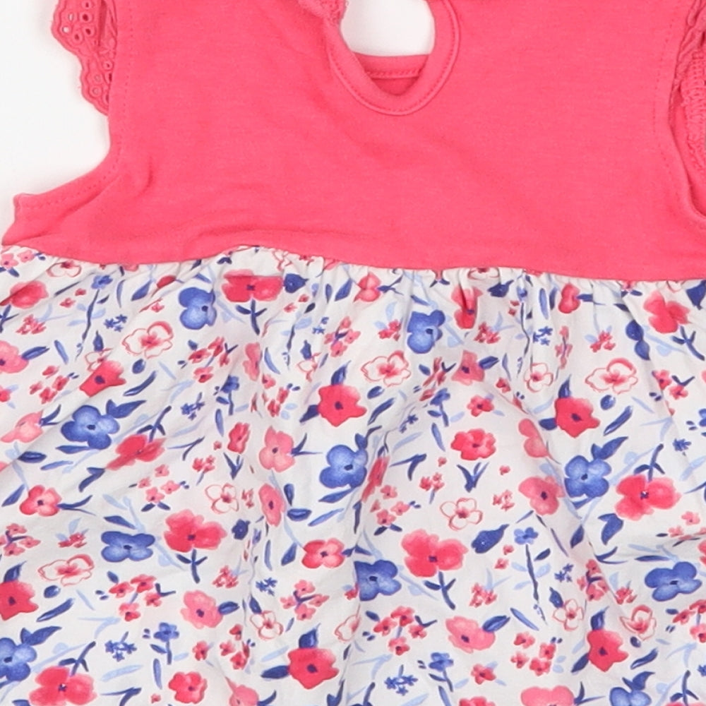 Brand and care label for George girls’ pink floral skater dress, size 0-3, months