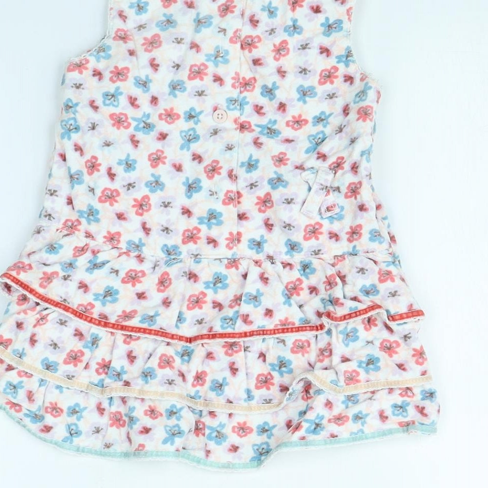 Brand and care label for John Lewis girls’ white floral fit & flare, size 12, months