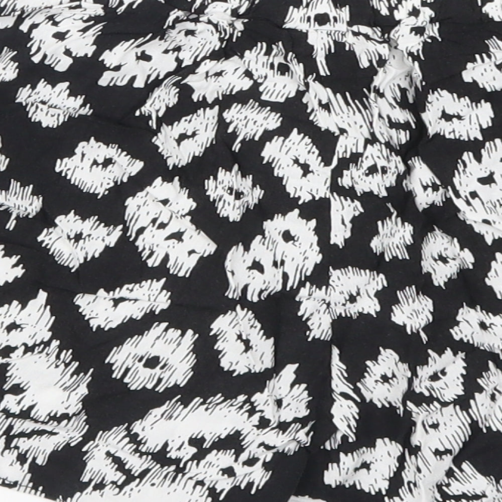 Brand and care label for Vero women’s black animal print paperbag shorts, size S