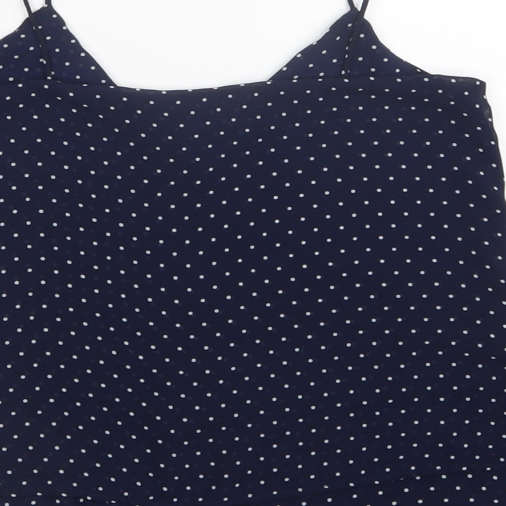 Brand and care label for H&M women’s blue polka dot mesh camisole t-shirt, size UK 4