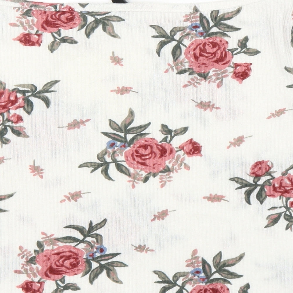 Brand and care label for H&M girls’ white floral cropped t-shirt, size M