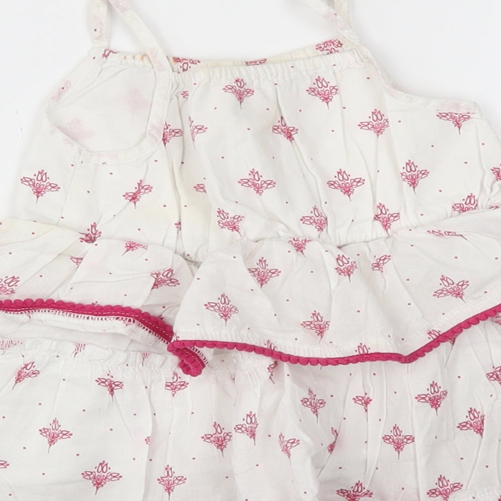 Brand and care label for Preworn girls’ white floral trapeze & swing, size 12-18, months