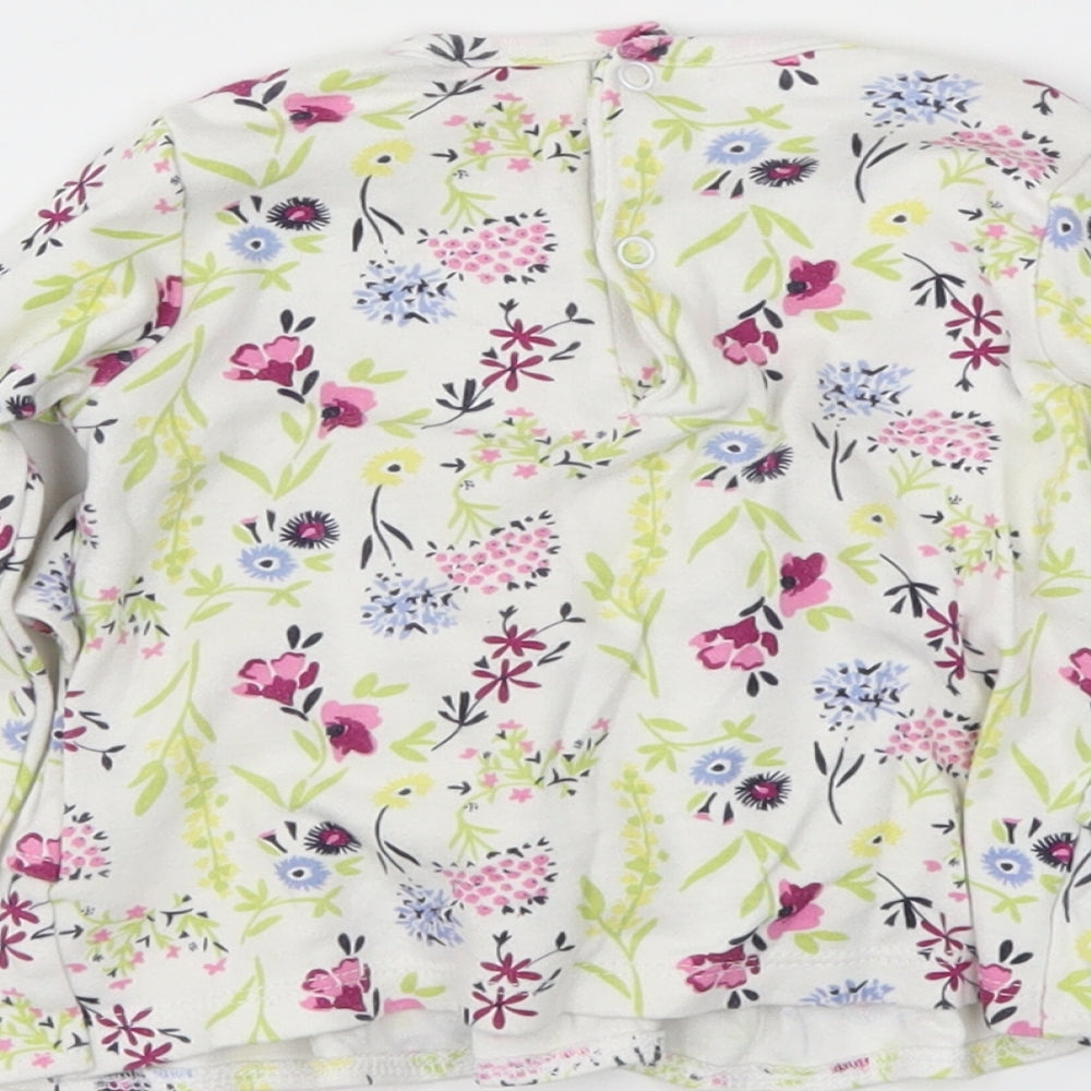 Brand and care label for mini mol girls’ white floral basic polo, size 6-9, months
