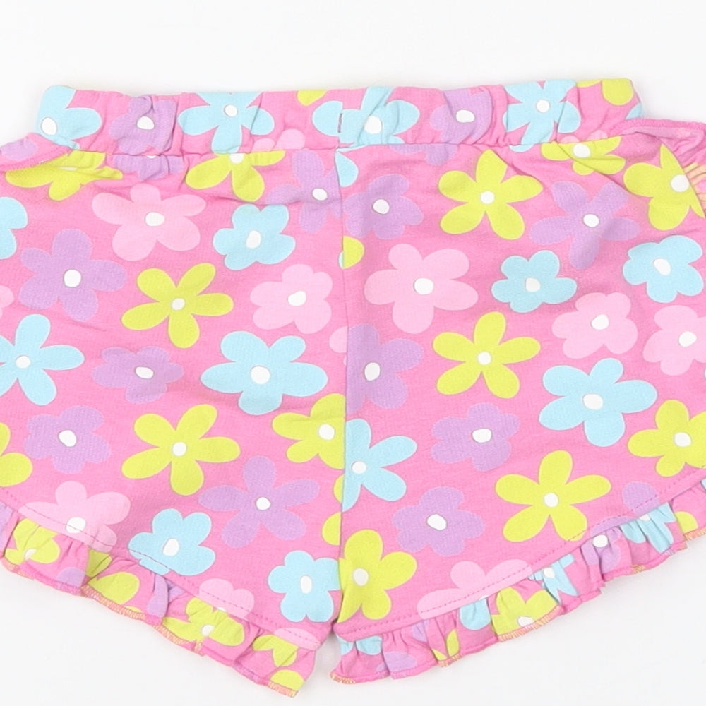 Brand and care label for Preworn boys’ pink floral cropped trousers, size 12-18, months