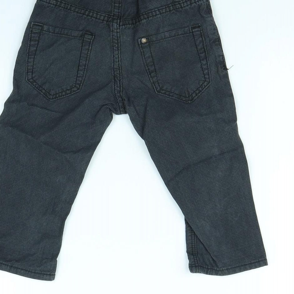 Brand and care label for H&M boys’ blue capri trousers, size 9, months