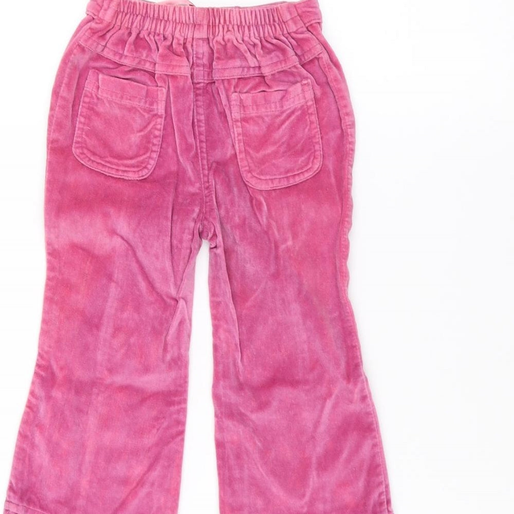 Brand and care label for Early Days girls’ pink sweatpants, size 9-12, months