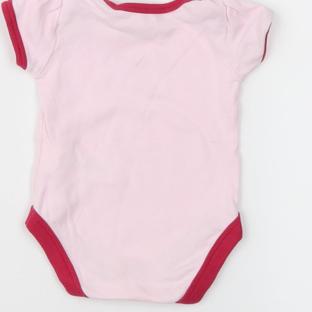 Brand and care label for Mothercare girls’ pink ringer t-shirt size newborn