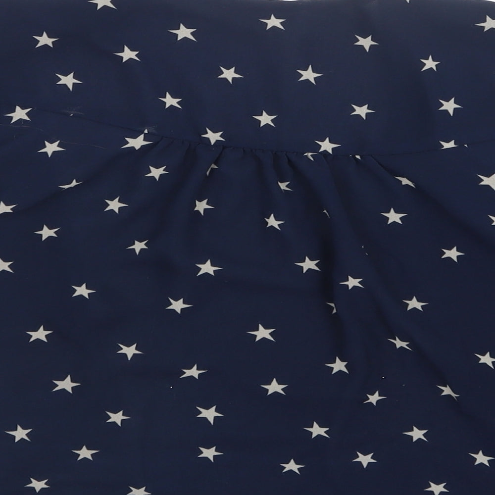 Brand and care label for Next girls’ blue geometric mesh jacket, size 7, years - stars