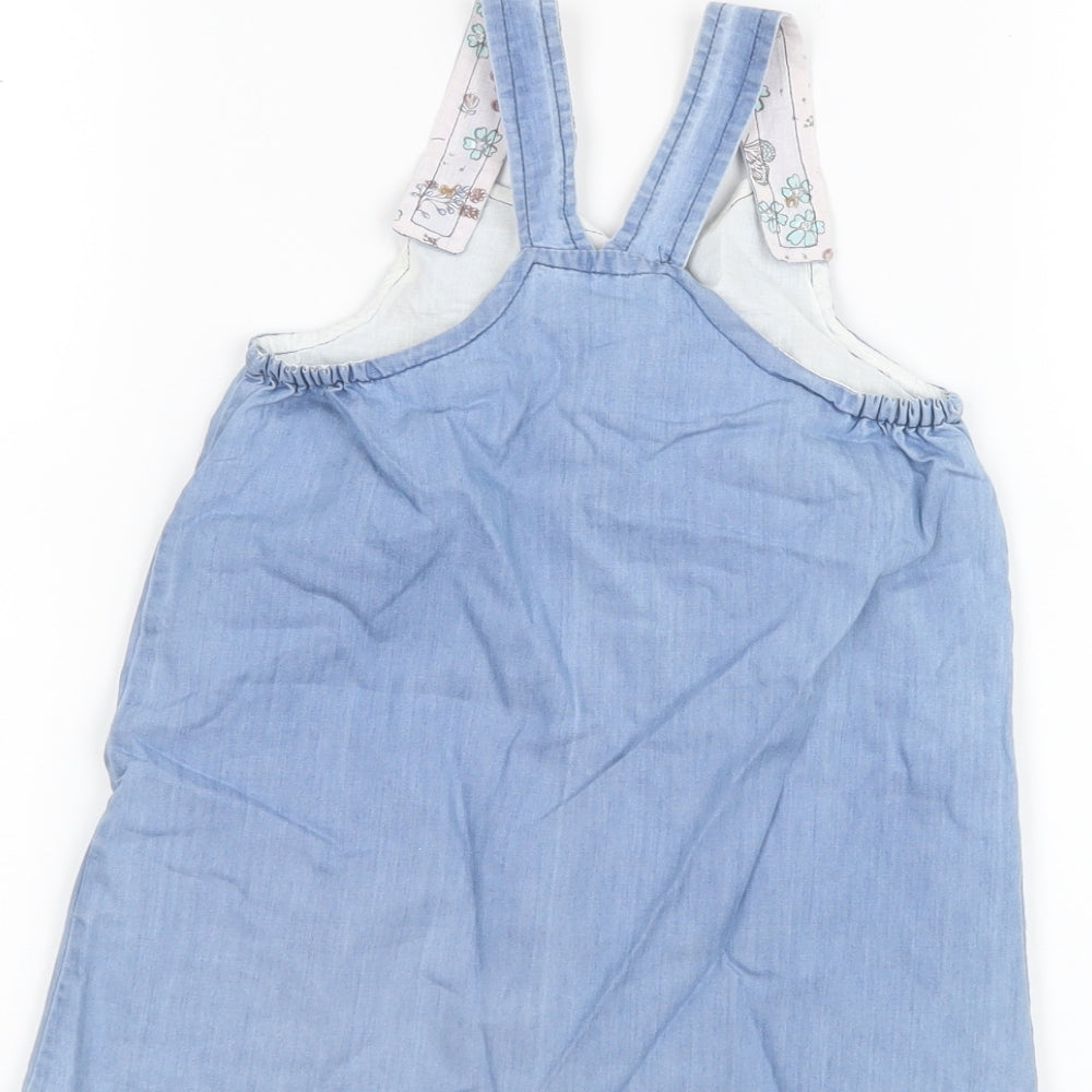 Brand and care label for Matalan girls’ blue pinafore/dungaree dress, size 9-12, months