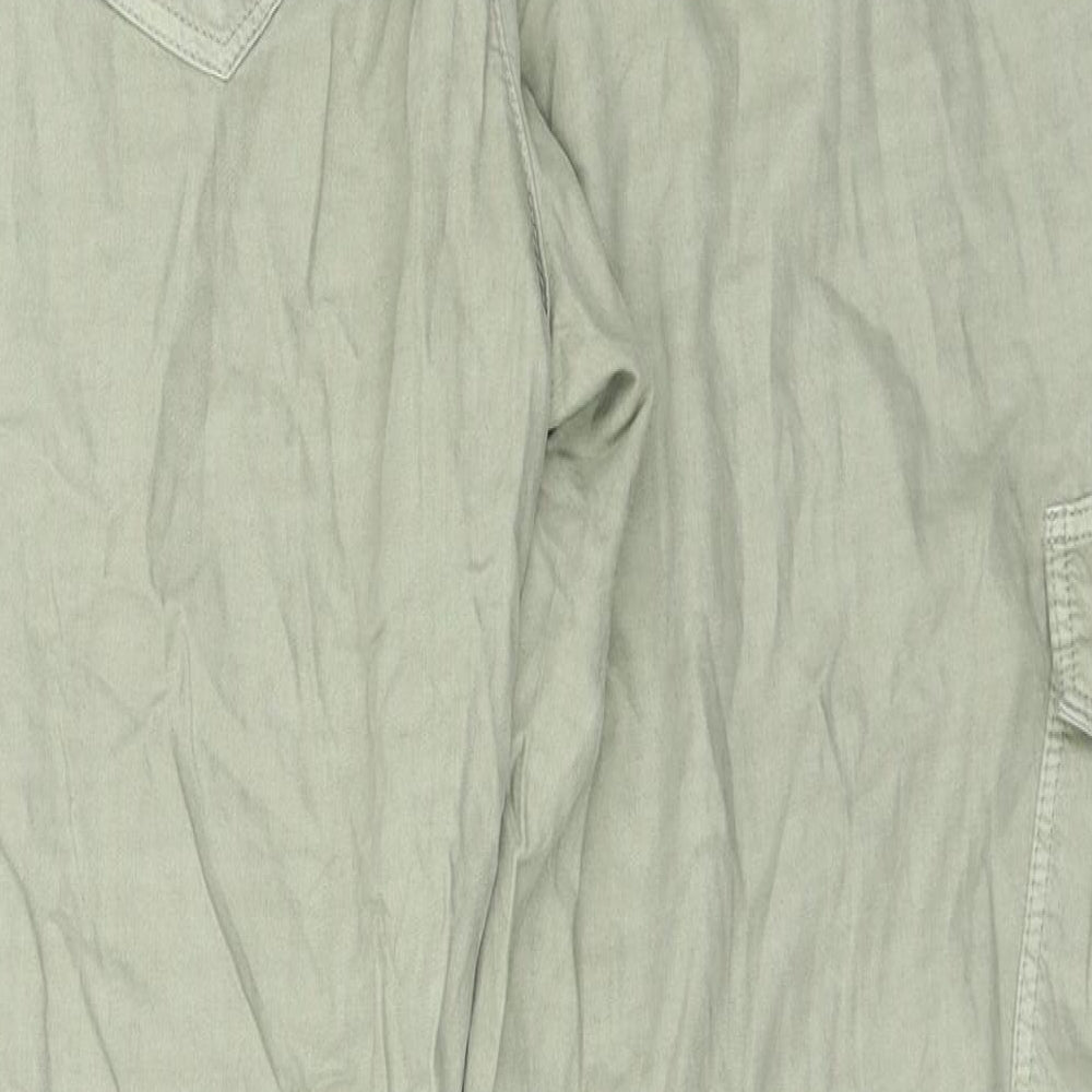 Brand and care label for Marks & Spencer women’s green trousers, size UK 34, in, 24-inch leg