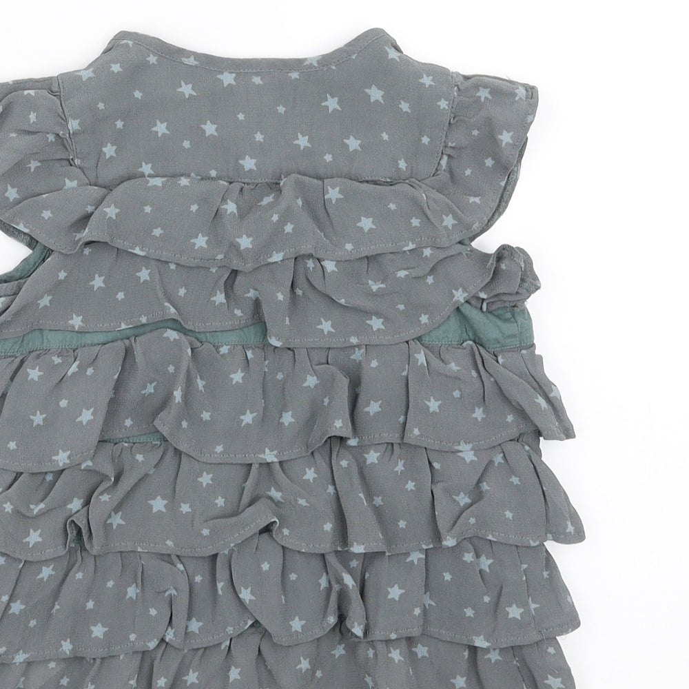 Brand and care label for Marks & Spencer girls’ green basic blouse, size 2-3, years - ruffle, stars