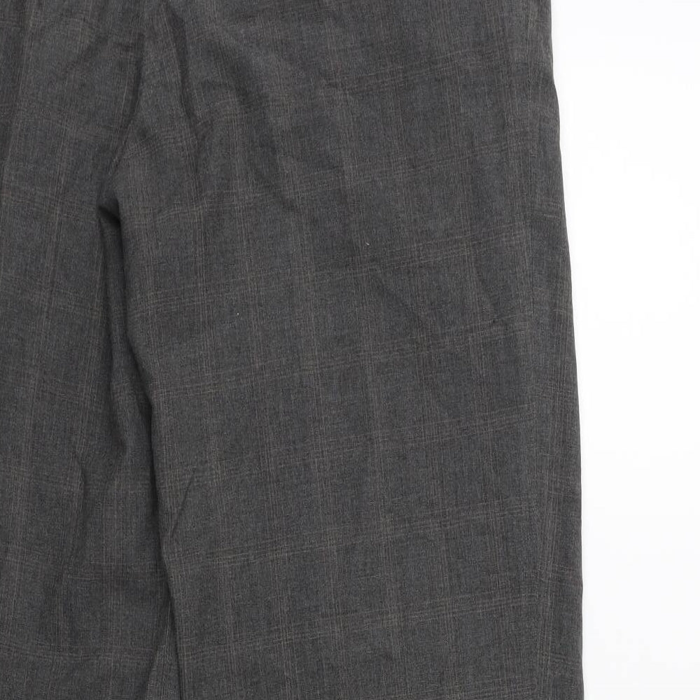 Brand and care label for Preworn men’s green trousers, size 34, in, 29-inch leg