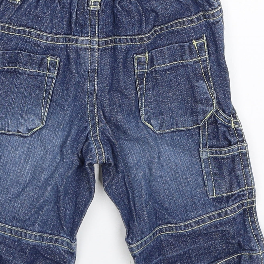 Brand and care label for Cherokee boys’ blue denim capri jeans, size 0-3, months