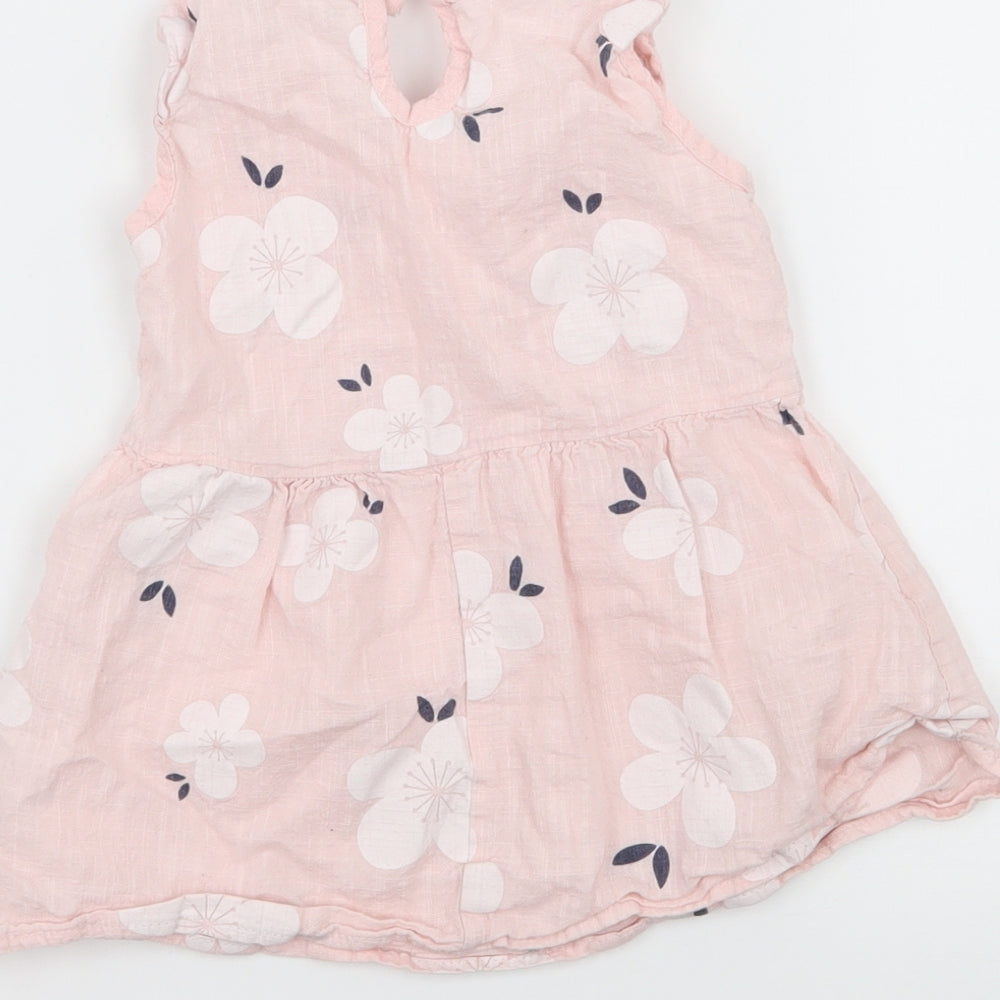Brand and care label for Preworn girls’ pink floral tank dress, size 6-9, months