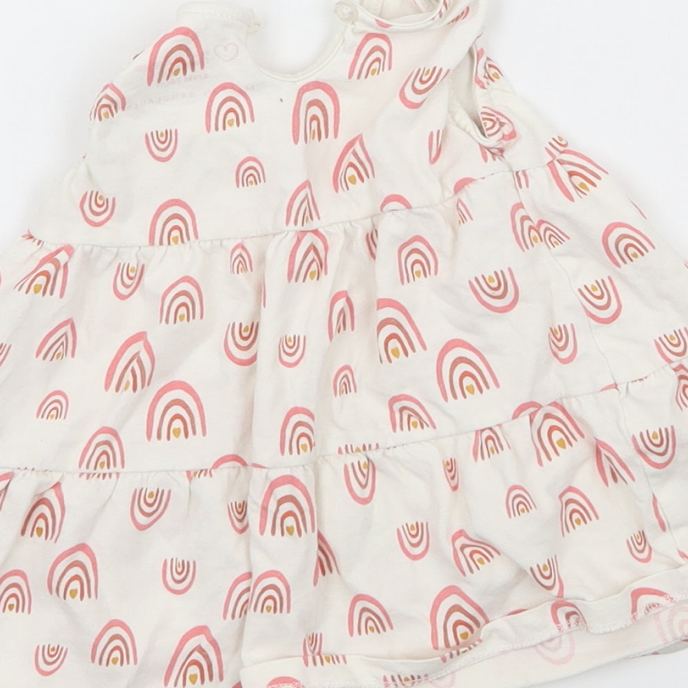 Brand and care label for Primark girls’ white geometric jersey tank dress, size 6-9, months