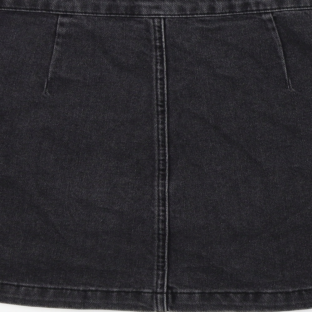 Brand and care label for Topshop women’s black a-line skirt, size UK 25, in