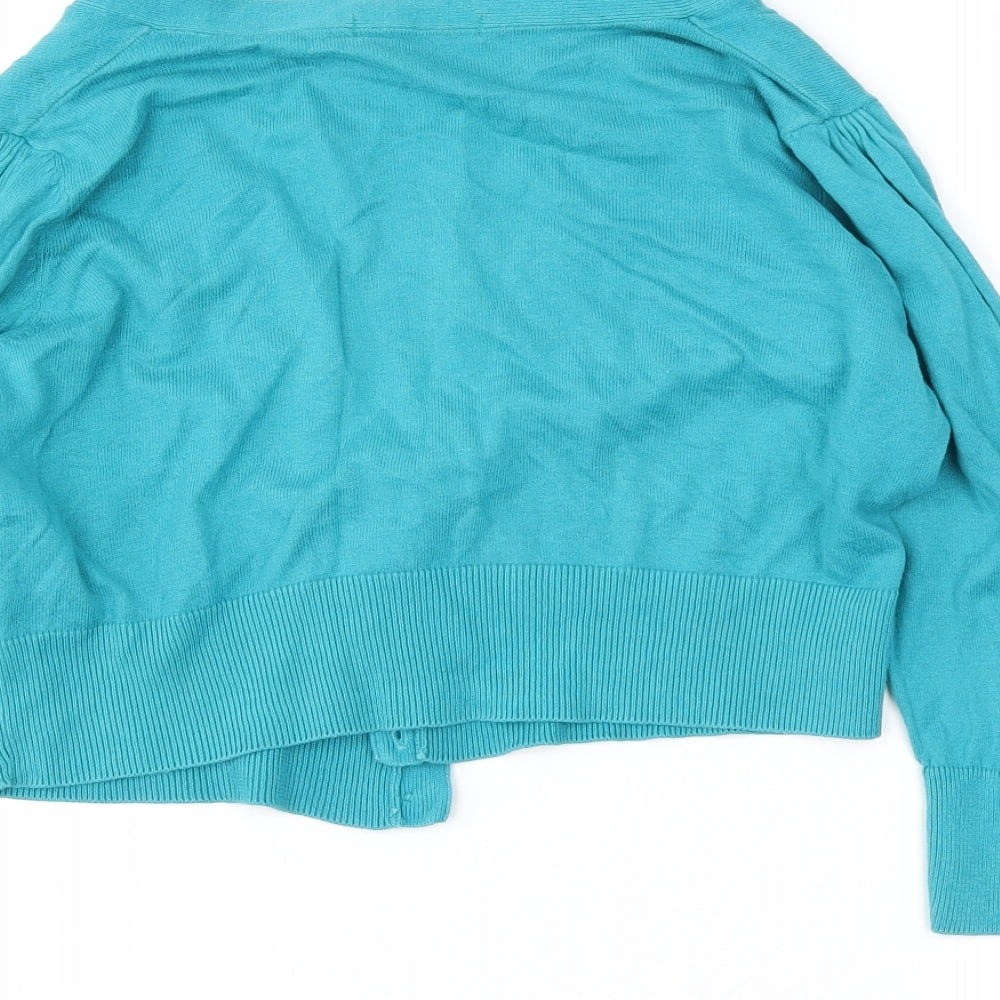 Brand and care label for Marks & Spencer women’s blue cardigan jumper, size UK 10