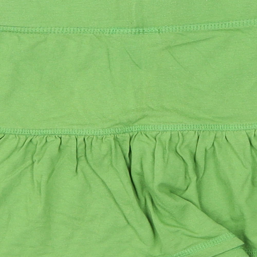 Brand and care label for Next girls’ green flare skirt, size 7, years
