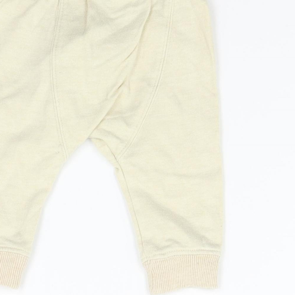 Brand and care label for F&F Baby Beige Track Pants Trousers, size 0-3, Months