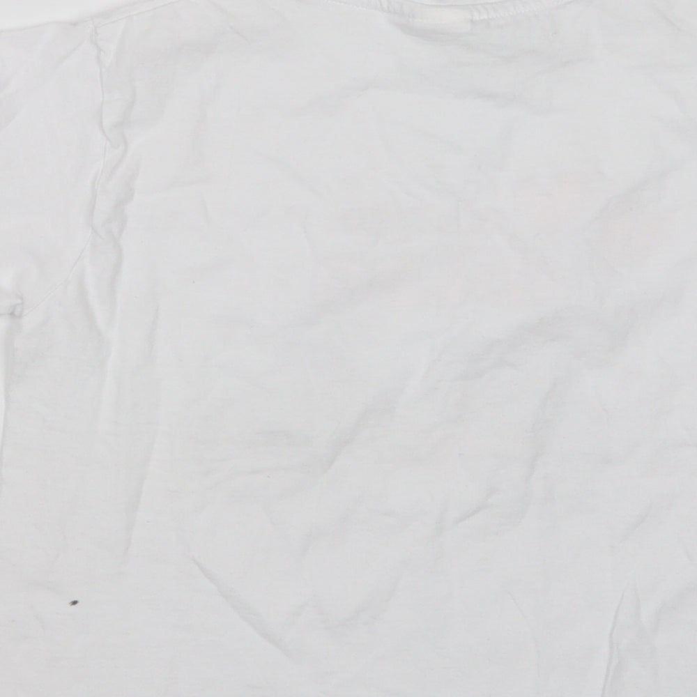 Brand and care label for Planet 2000 girls’ white basic t-shirt, size 10, years