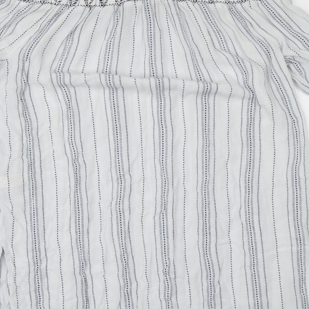Brand and care label for New Look women’s white striped ringer blouse, size M