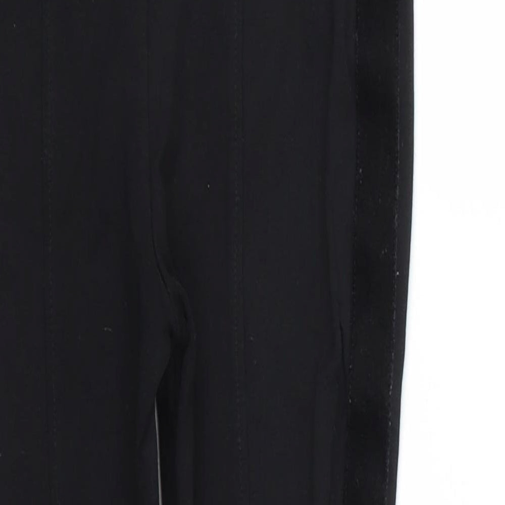 Brand and care label for Next girls’ black jegging trousers, size 8, years