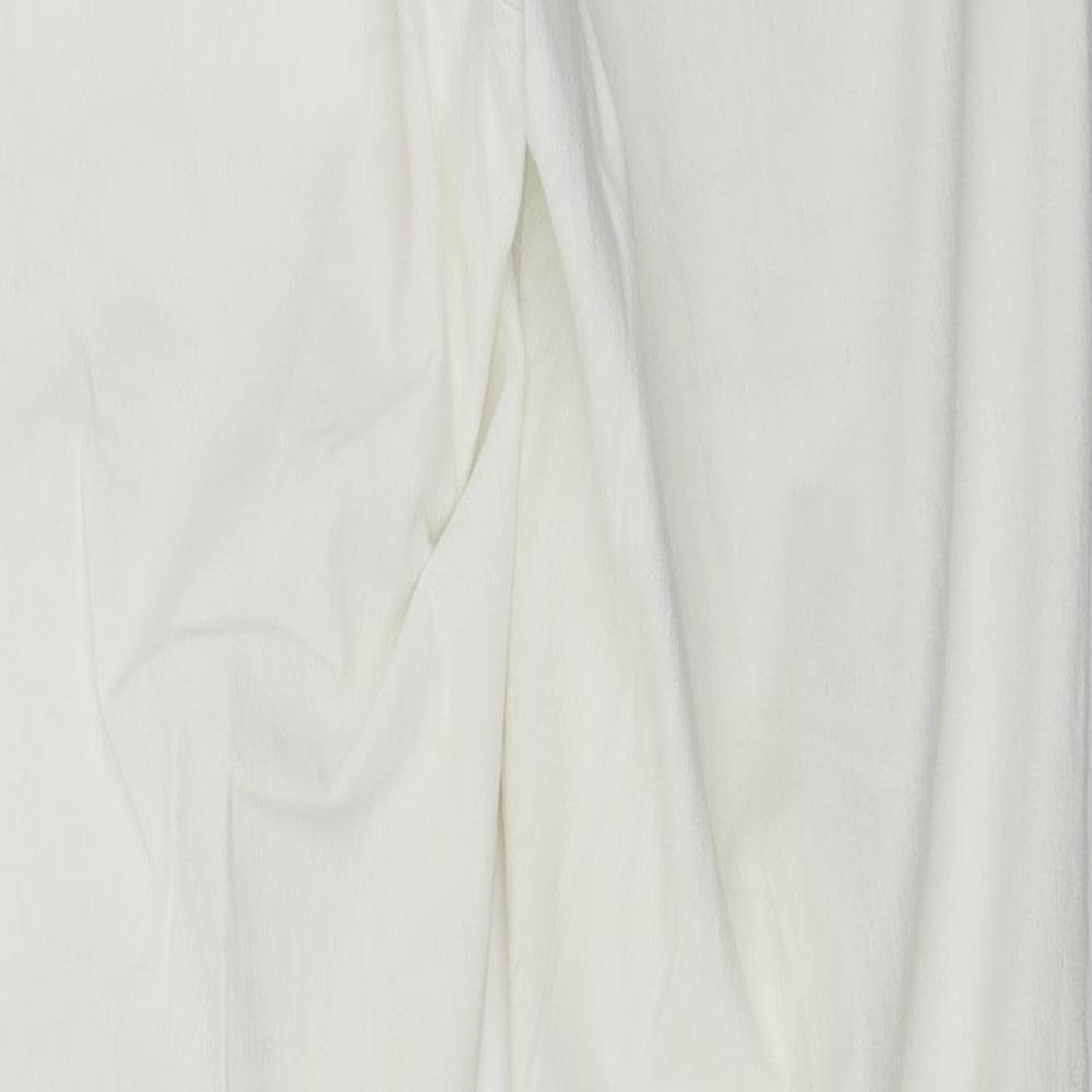 Brand and care label for C&A women’s white trousers, size UK 30, in, 27-inch leg